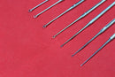 Buck Ear Curette Set of 7 Piece Sharp Point Round handle overall length 6.5"